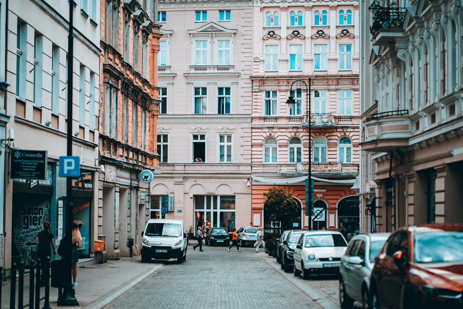 a street with cars and buildings on either side of it